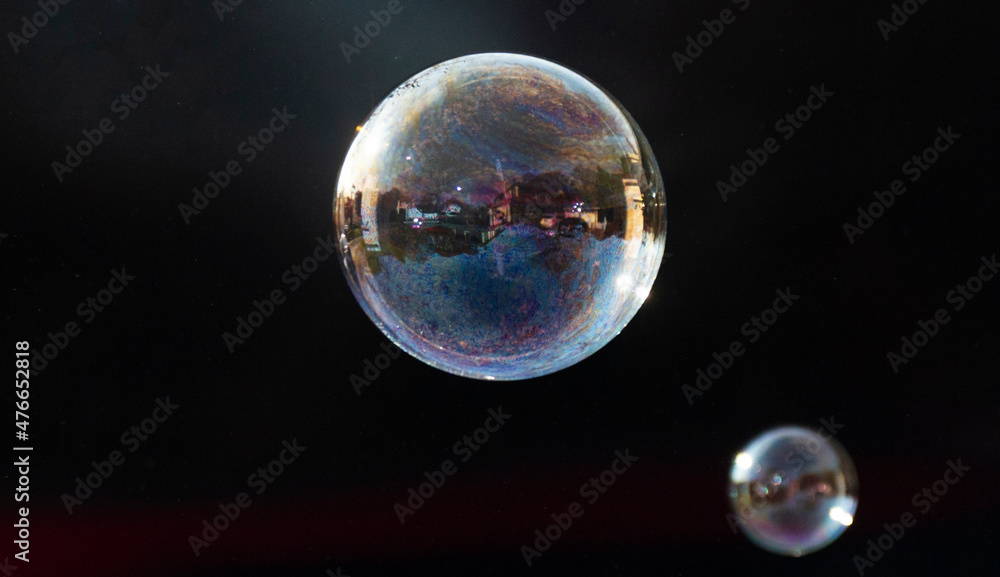 Soap bubbles floating in air with a black background Soap bubbles floating in air with a black background