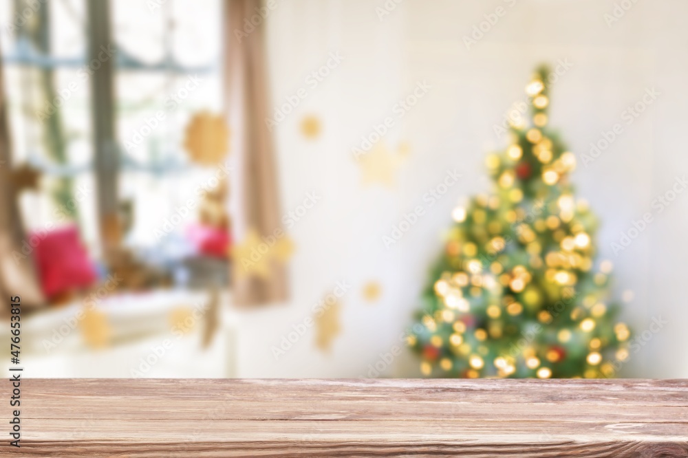 Table space in front of defocused Christmas tree Table space in front of defocused Christmas tree