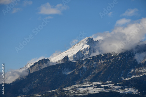 Snow-covered mountain, valley and blue sky in the European Alps, seen from Vaduz, Liechtenstein © Anne Czichos