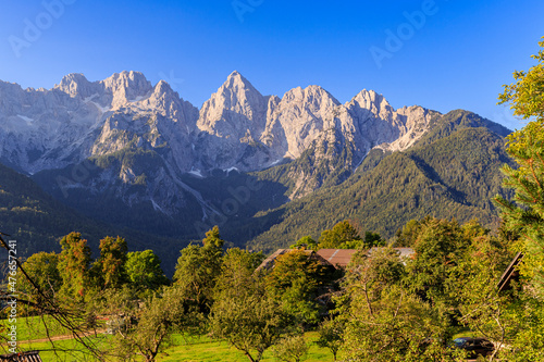 sunrise at Triglav Nationalpark, mountain scenery with an glowing spik peak, near Kranjska Gora, Slovenia photo