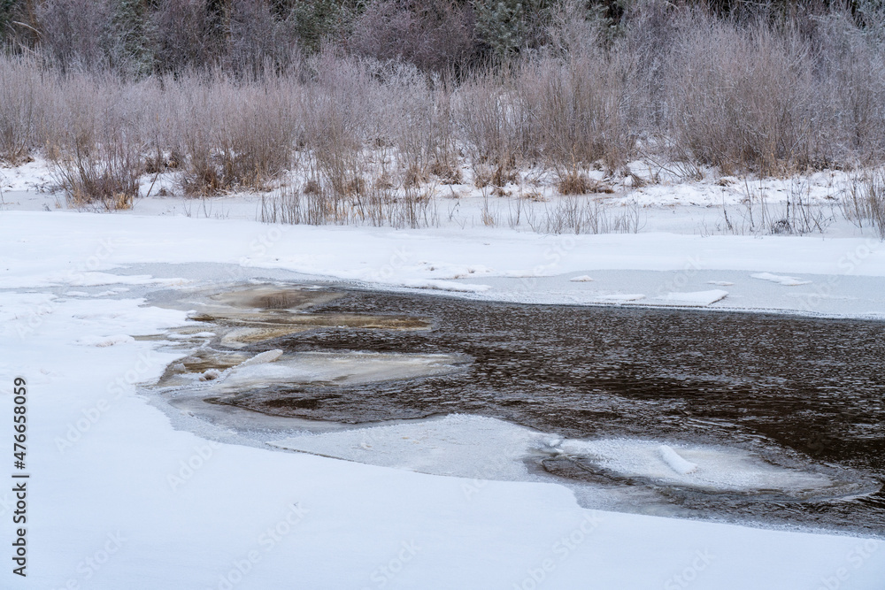 frozen river in winter frozen river in winter