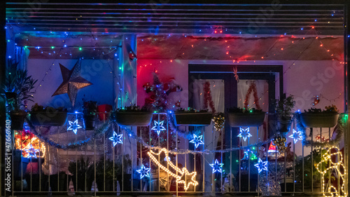 Balcony decorated with light garlands for Christmas