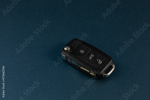 Car keys with blue background and space for text