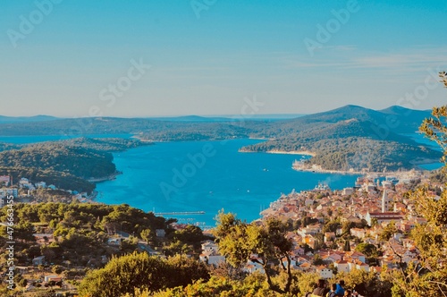 Panoramic view to the city and port of Mali Losinj. Island Losinj blue lagoon with Osorcica mountain in background. Adriatic Sea.Buildings and houses.