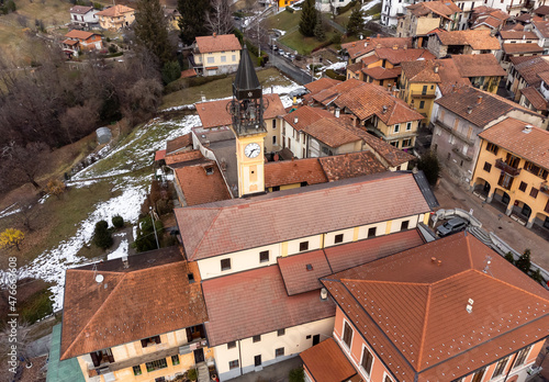 Aerial view of the bell tower of the Saint Ilario di Poitiers Church in Bedero Valcuvia, province of Varese, Lombardy, Italy photo