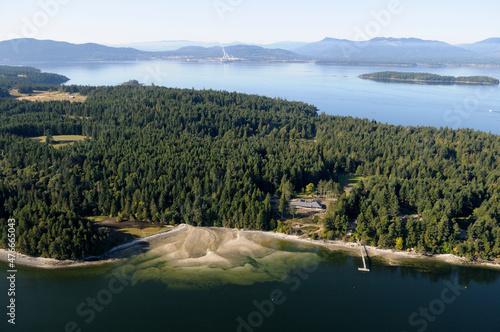 Aerial photo of an estuary at the northern end of Saltspring Island. Osborne Bay and the Crofton Paper Mill are in the background on Vancouver Island, Saltspring Island, British Columbia, Canada photo