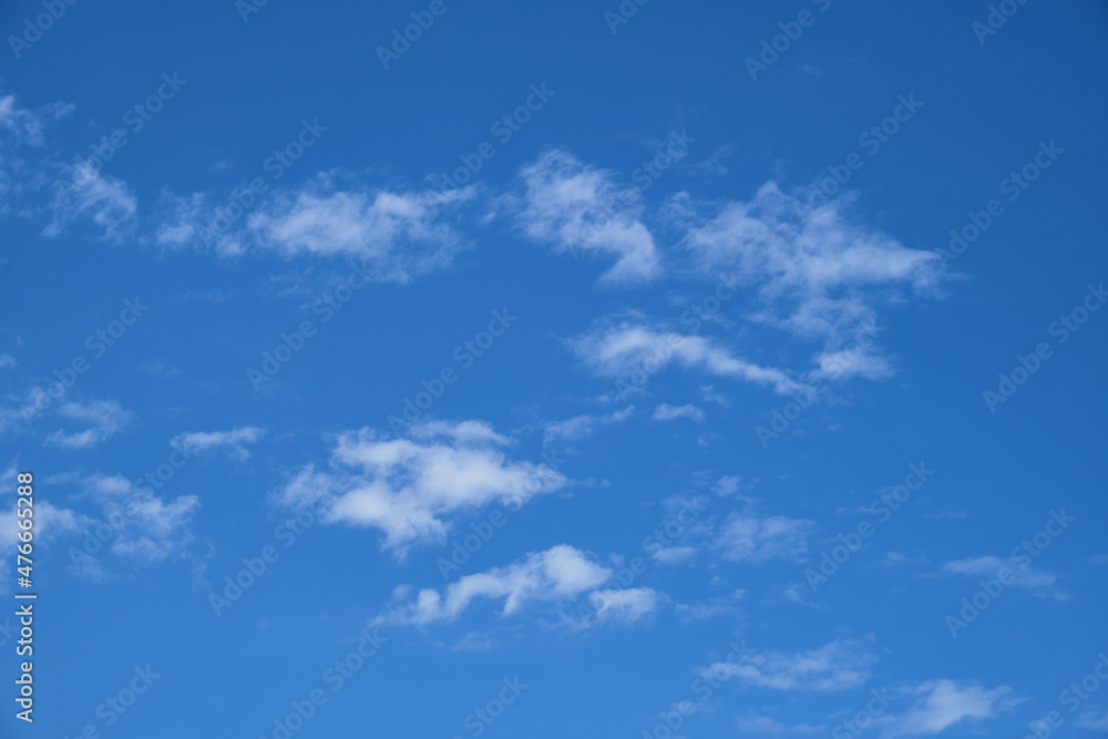Partly clouds and blue sky. Pieced clouds.