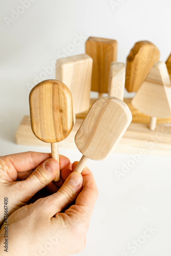 Close up of wooden montessori toy on woman hands photo