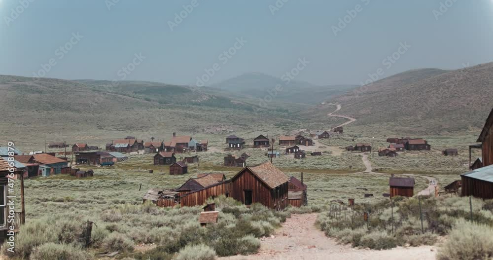 Slow motion pan of Bodie, California, a preserved ghost town in the hills of CA Slow motion pan of Bodie, California, a preserved ghost town in the hills of CA
