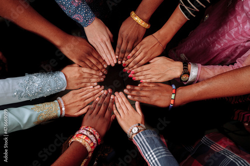 Hands of happy group of African people which stay together in circle happy