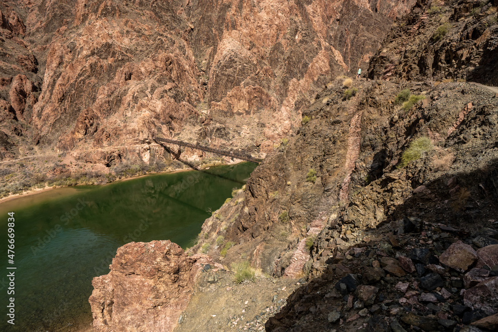 Hiker Looks Out Over The Black Bridge On The Colorado River