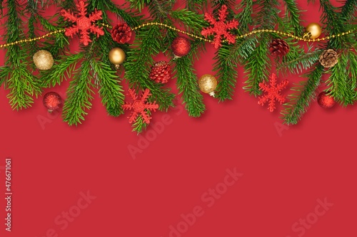 Banner with fir branches and Christmas decorations on desk background.