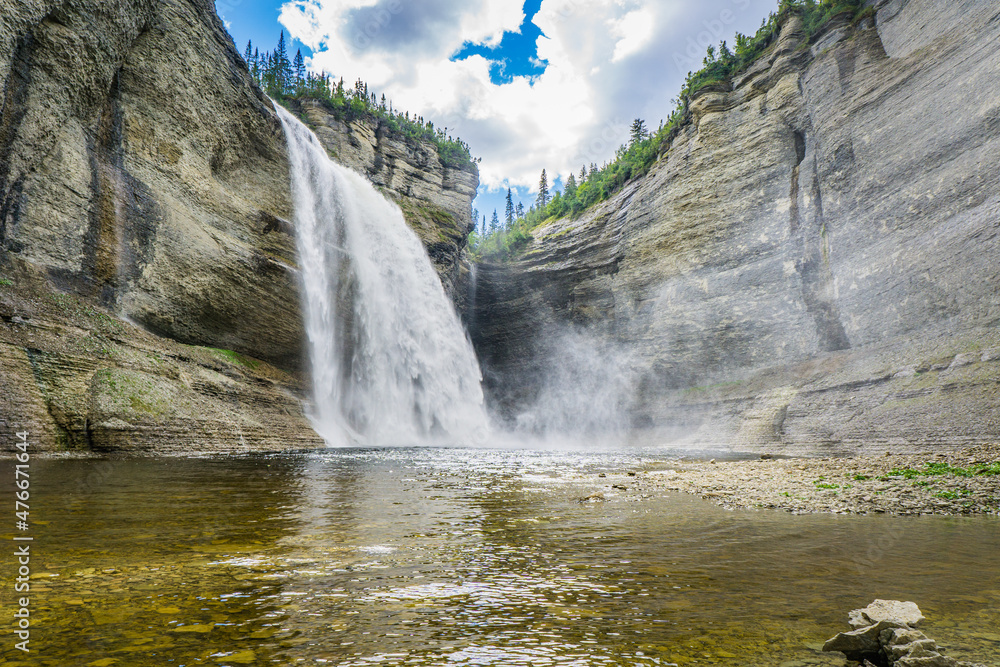 Obraz premium View on the Vaureal waterfall from the canyon, the most impressive waterfall of Anticosti Island, in Cote Nord region of Quebec, Canada
