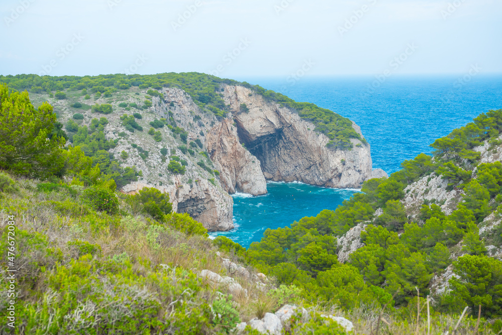 Beautiful Scenery Of The Famous Costa Bravia cliff and caves in Spain. Dramatic views of peaks, rock, valley, landscape, green forest. Adventure, freedom, fun concepts. Tourist mountain trek. Beautiful Scenery Of The Famous Costa Bravia cliff and caves in Spain. Dramatic views of peaks, rock, valley, landscape, green forest. Adventure, freedom, fun concepts. Tourist mountain trek.