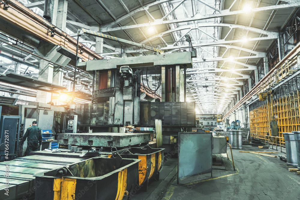 Interior of big industrial metalworking factory building with steel machinery, metallurgical plant.