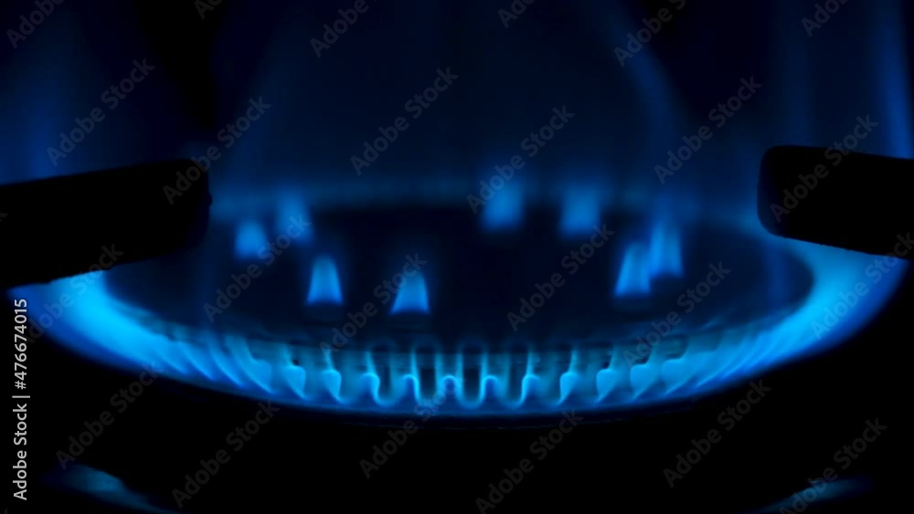 Gas stove being turned on isolated on black background. Natural gas deficit concept. Slow motion full HD video. Gas stove being turned on isolated on black background. Natural gas deficit concept. Slow motion full HD video.