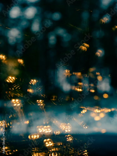 String of lights reflecting from a window © Romi