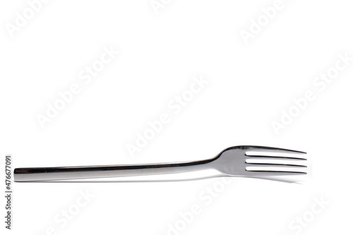 Closeup metal dinner fork isolated white background