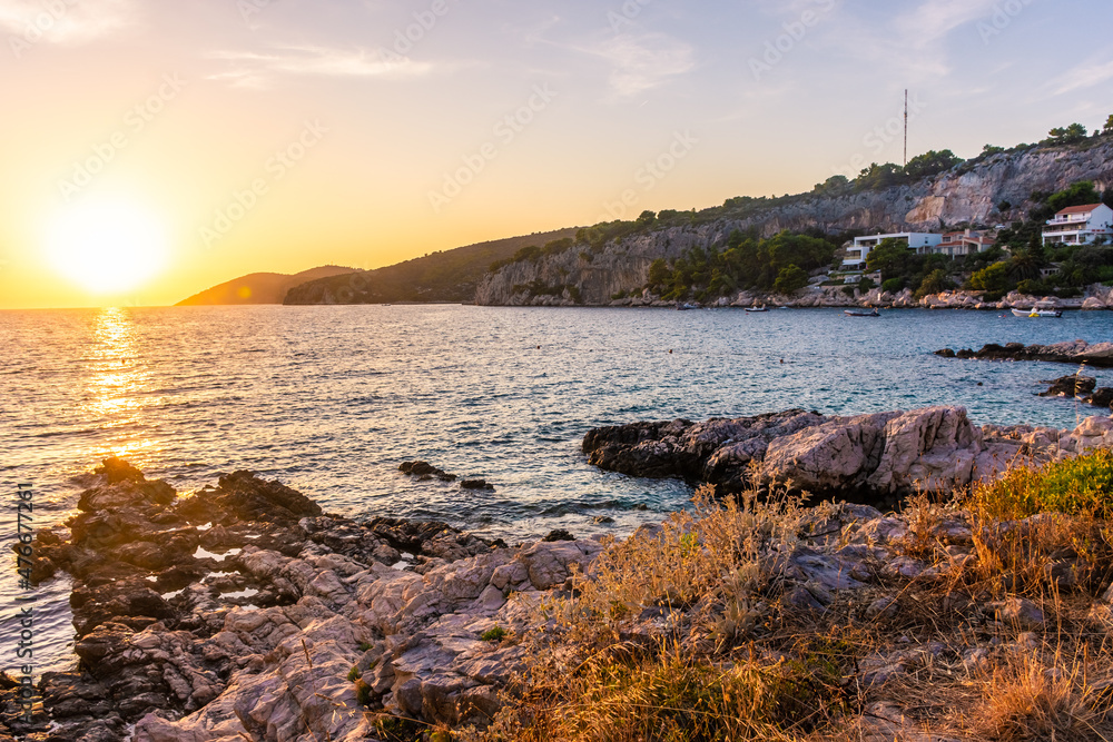 Beautiufl sunset on the rocky beach of Hvar Island, Croatia