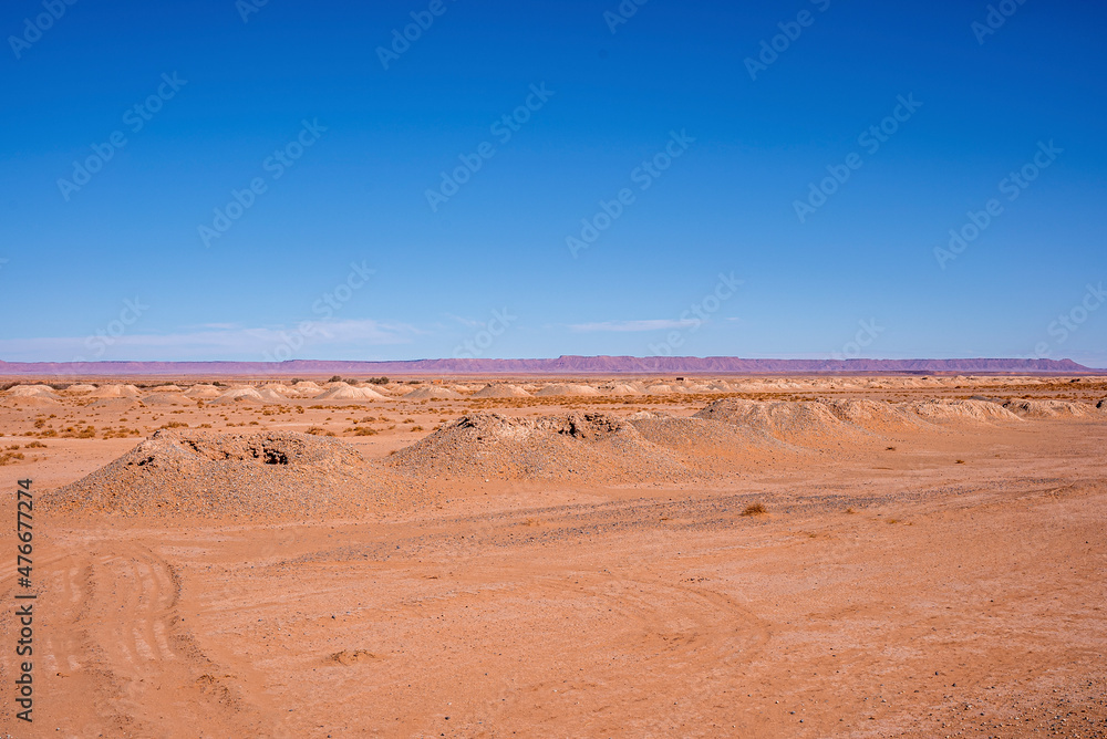 Beautiful view of sand dunes in desert with mountains on sunny summer day, View of sand dunes landscape against sky