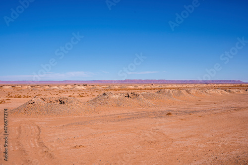 Beautiful view of sand dunes in desert with mountains on sunny summer day, View of sand dunes landscape against sky