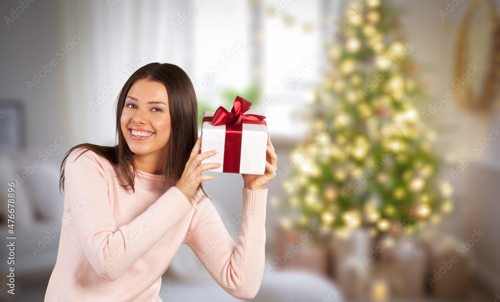 Woman hands holding a handmade square gift Woman hands holding a handmade square gift