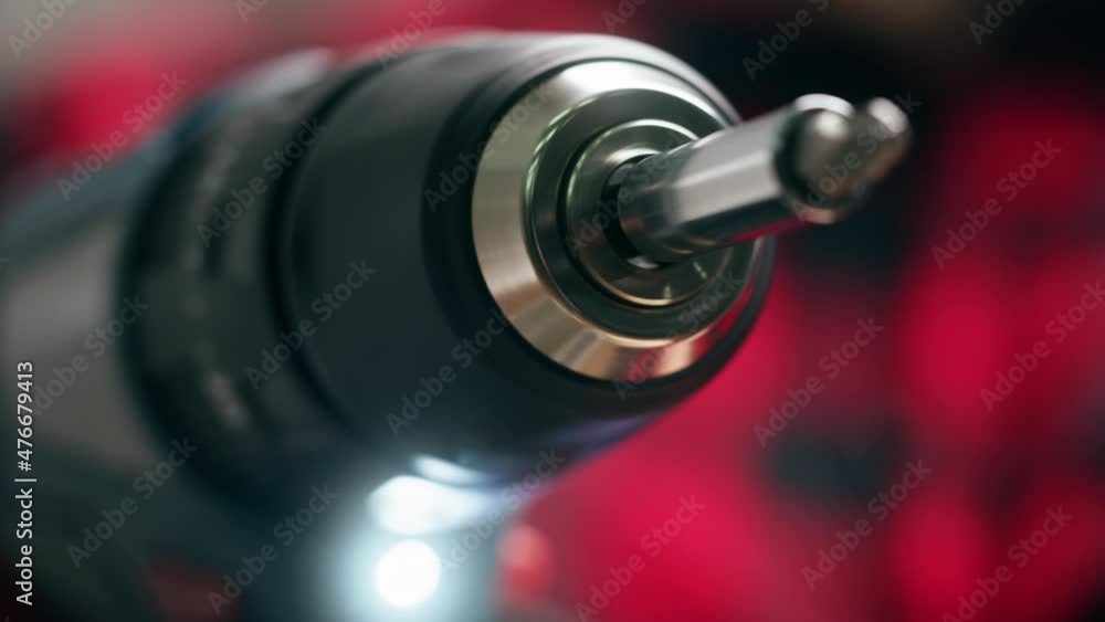 Holding electric screwdriver close-up. Renovation concept. Building new house or flat. Professional tools for construction. Holding electric screwdriver close-up. Renovation concept. Building new house or flat. Professional tools for construction.