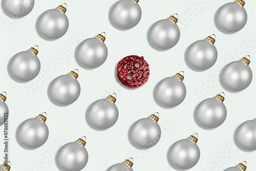 Red and silver shiny Christmas baubles on a pastel background. Christmas decorations.