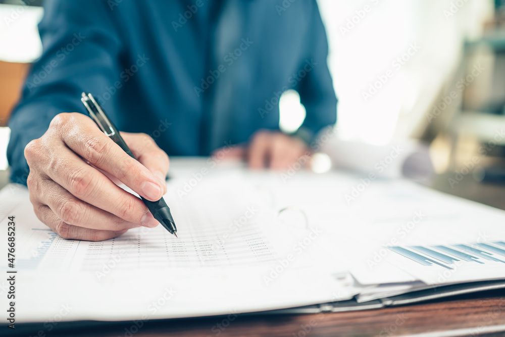 Businessman working on office desk and analyzing new project of accounting finance. Investment, Financial advisor, budget, plan and accounting concept. Businessman working on office desk and analyzing new project of accounting finance. Investment, Financial advisor, budget, plan and accounting concept.