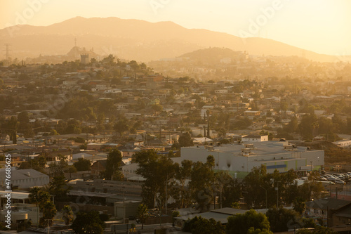 Tecate, Baja California, Mexico - September 14, 2021: Late afternoon sun shines on a bustling downtown Tecate.