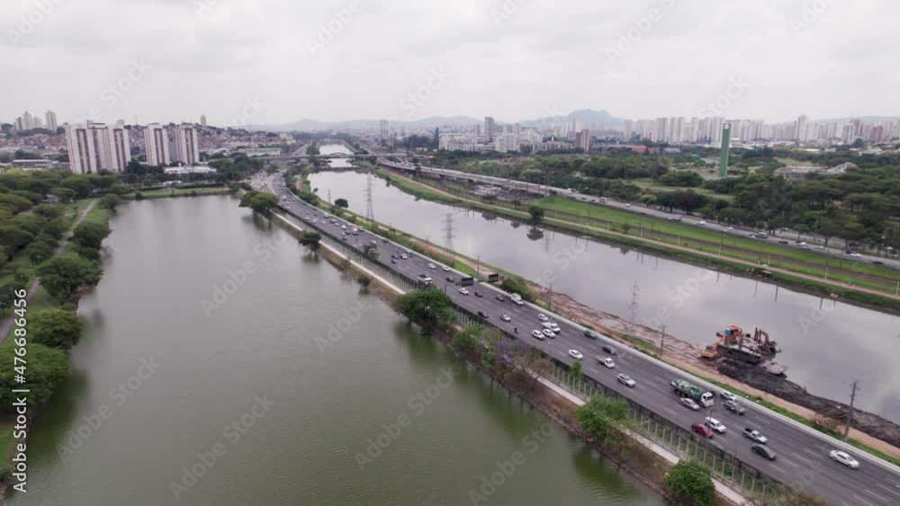 Slow traffic on the highway. Rio Pinheiros in Sao Paulo, Brazil. City footage. Slow traffic on the highway. Rio Pinheiros in Sao Paulo, Brazil. City footage.