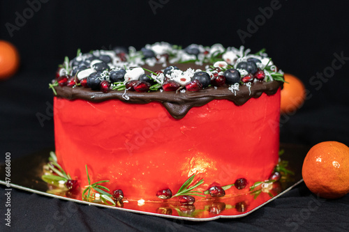 Christmas Day Cake Decoration. Holiday Cake round shaped on a gold substrate black background.
