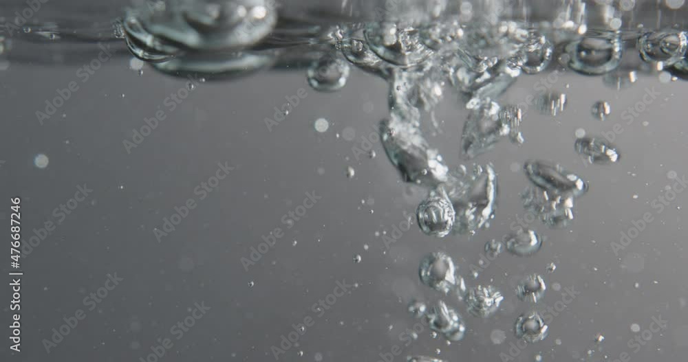 Liquid Pouring Through Water Surface And Creating Bubbles Liquid Pouring Through Water Surface And Creating Bubbles