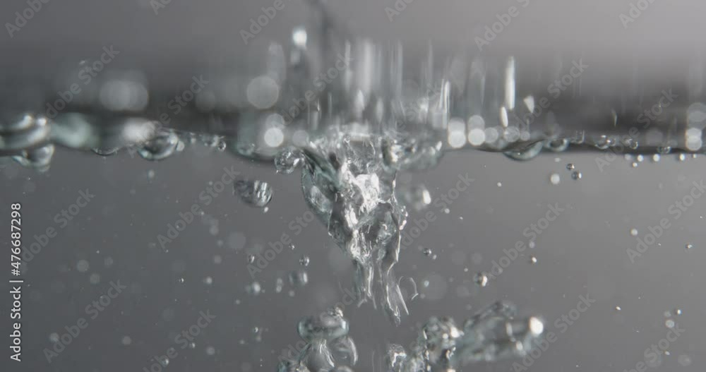Liquid Pouring Through Water Surface And Creating Bubbles Liquid Pouring Through Water Surface And Creating Bubbles