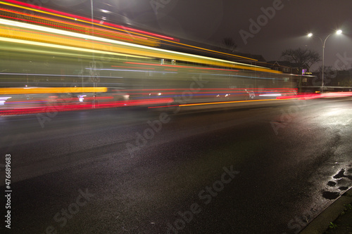 City street at night with light streaks © Aleksandr