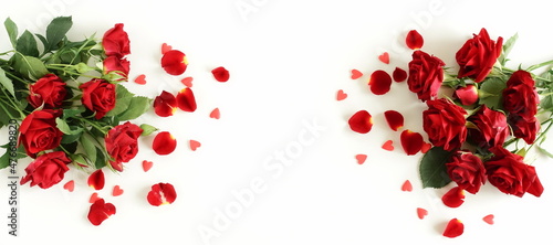 Red roses and petals frame isolated on white background with copy space.Banner.Selective focus.
