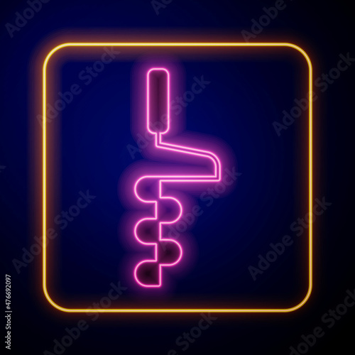 Glowing neon Hand ice drill for winter fishing icon isolated on black background. Vector