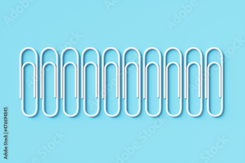 Paper clip on a blue background. 3d rendering illustration.