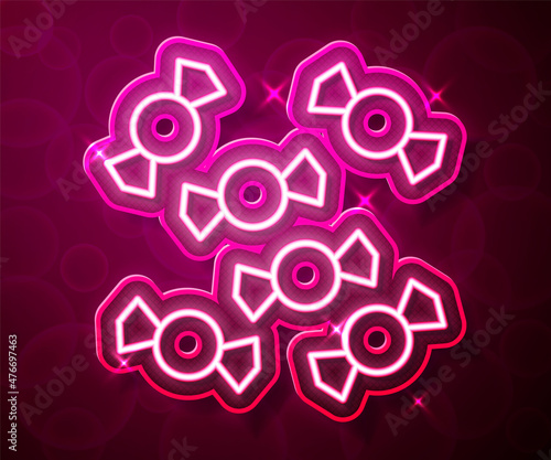 Glowing neon line Candy icon isolated on red background. Merry Christmas and Happy New Year. Vector