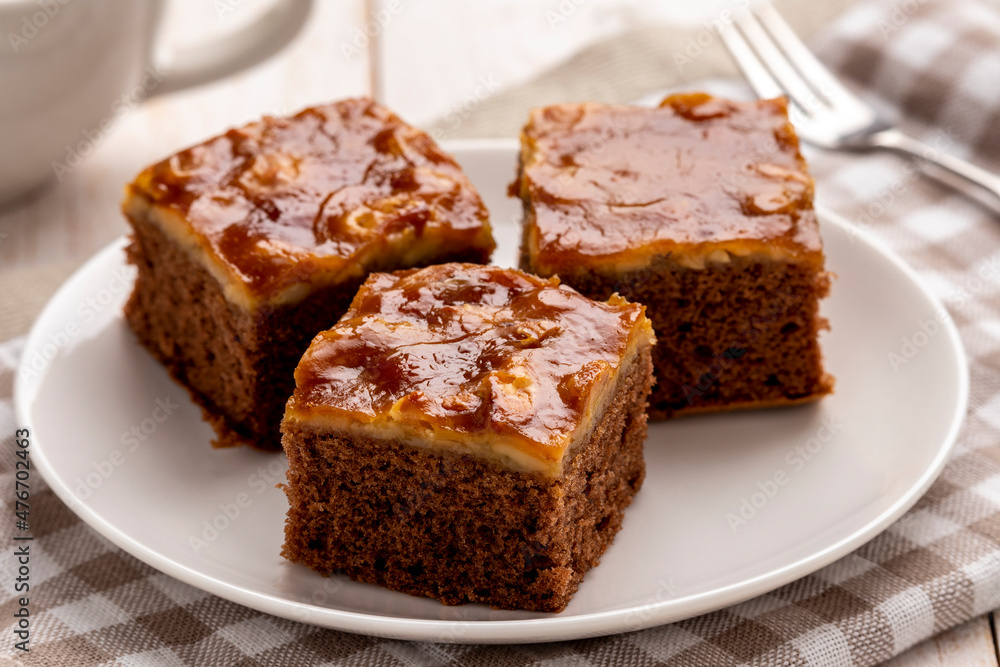 Mini mocha cashew toffee cake, easy to make crunchy, buttery, caramelly cashew crust on top of the moist and tender mocha cake, served on a white plate. It has coffee, caramel and butter in one place. Mini mocha cashew toffee cake, easy to make crunchy, buttery, caramelly cashew crust on top of the moist and tender mocha cake, served on a white plate. It has coffee, caramel and butter in one place.