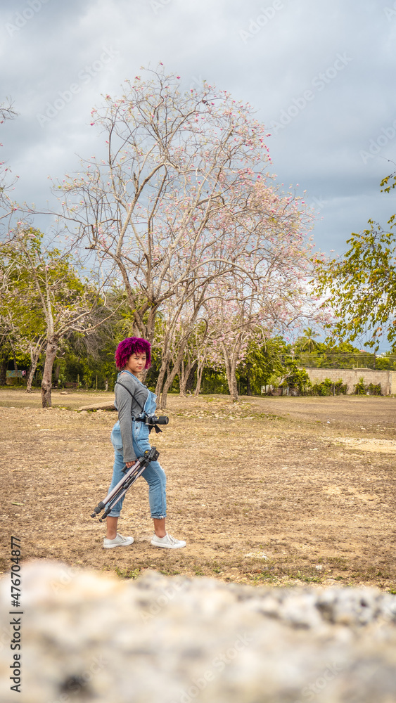 Girl who is dedicated to photography prepares from home to go to take photos of nature. Girl who is dedicated to photography prepares from home to go to take photos of nature.