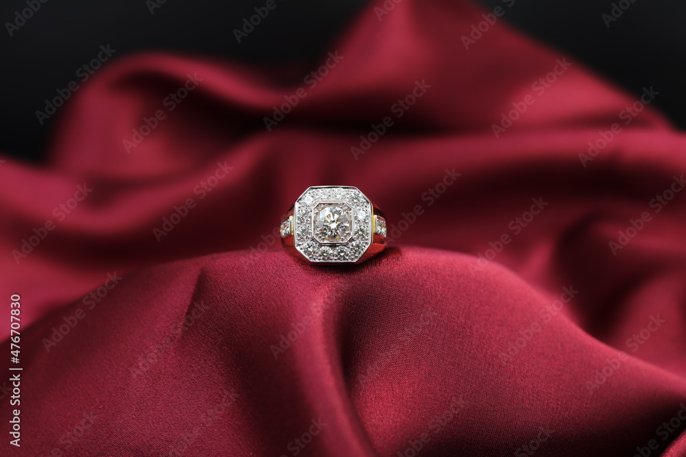 High jewelry banner with color natural gemstone and diamonds on gold ring setting. Red satin Background for jewelry shop High jewelry banner with color natural gemstone and diamonds on gold ring setting. Red satin Background for jewelry shop