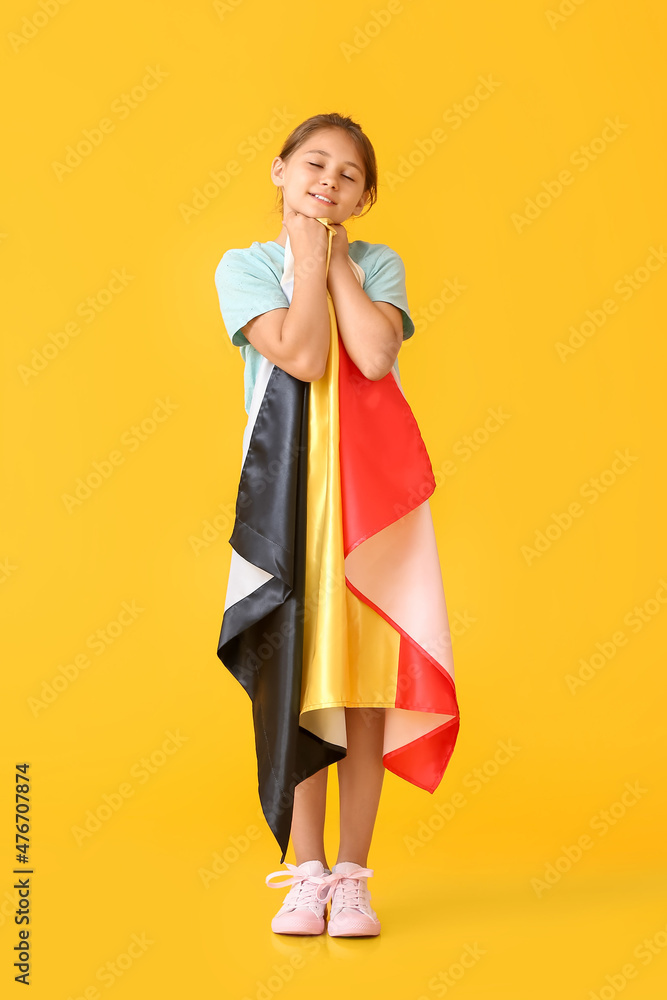 Little girl with flag of Belgium on color background Little girl with flag of Belgium on color background