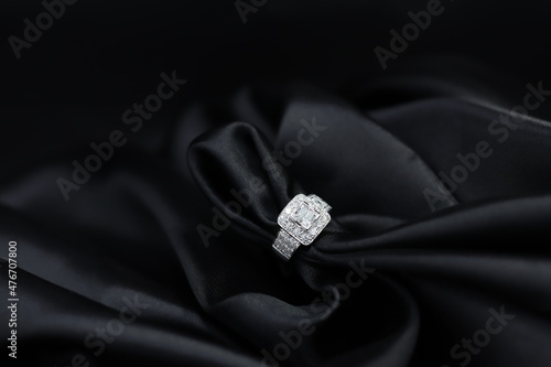 High jewelry banner with color natural gemstone and diamonds on gold ring setting. Black satin background for jewelry shop