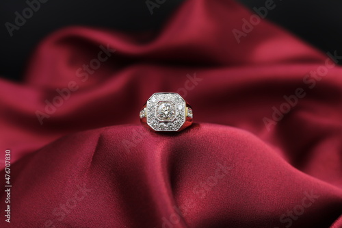 High jewelry banner with color natural gemstone and diamonds on gold ring setting. Red satin Background for jewelry shop