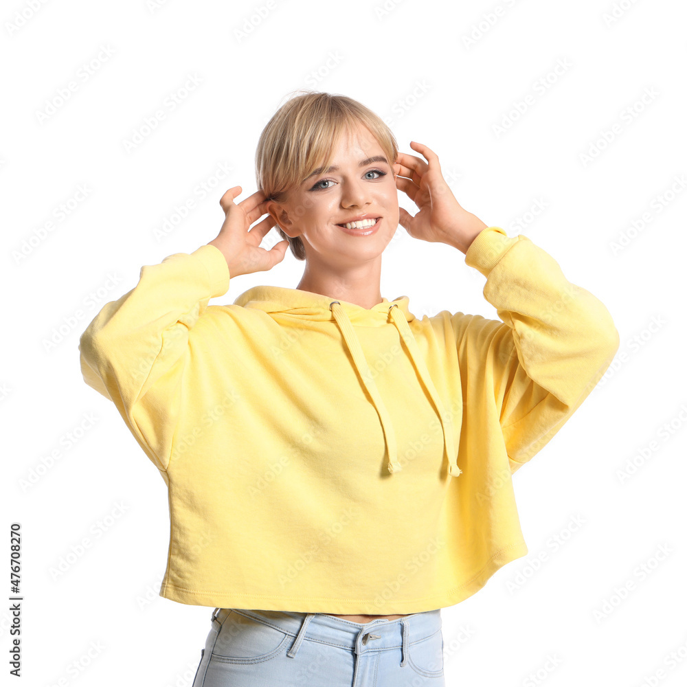 Beautiful young woman in stylish hoodie on white background Beautiful young woman in stylish hoodie on white background