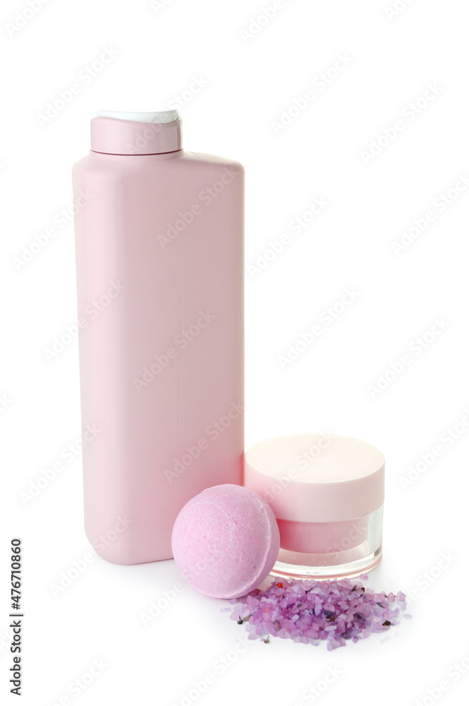 Cosmetics, bath bomb and sea salt on white background