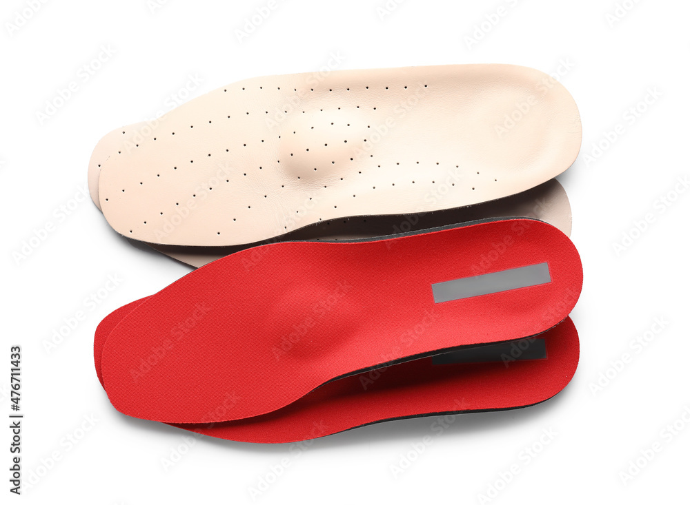 Different orthopedic insoles on white background Different orthopedic insoles on white background