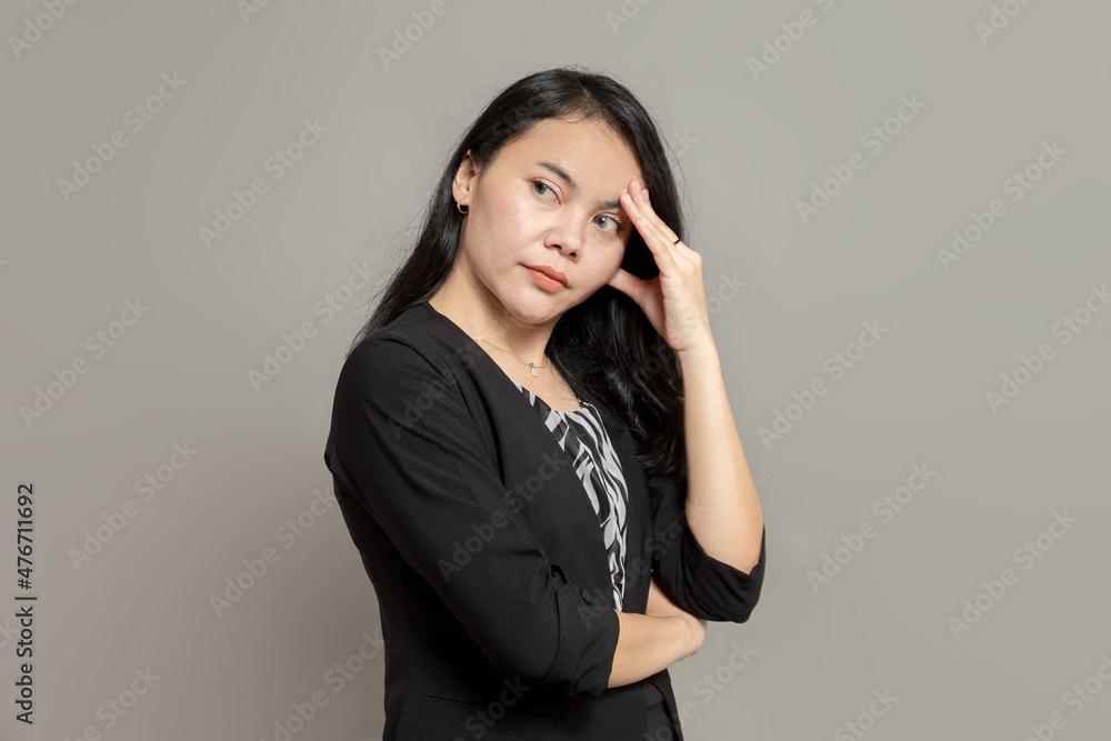 Business woman stress expression while holding head Business woman stress expression while holding head