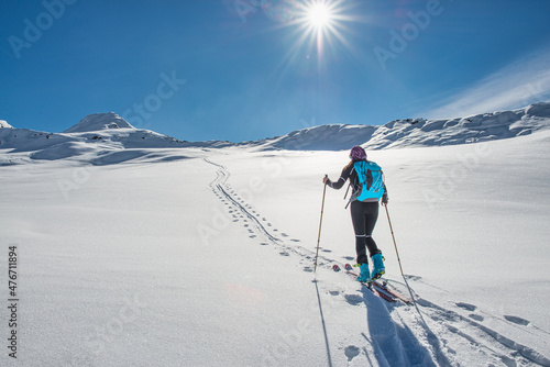 Ski touring uphill track with a skirt following it